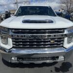 A white truck parked in the parking lot.