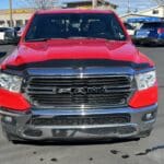 A red truck is parked in the parking lot.