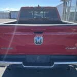 A red truck is parked in the lot