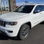 A white jeep parked in the parking lot.