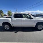 A white truck parked in the parking lot.