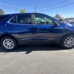 A blue car parked in the parking lot