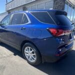 A blue car parked in the parking lot