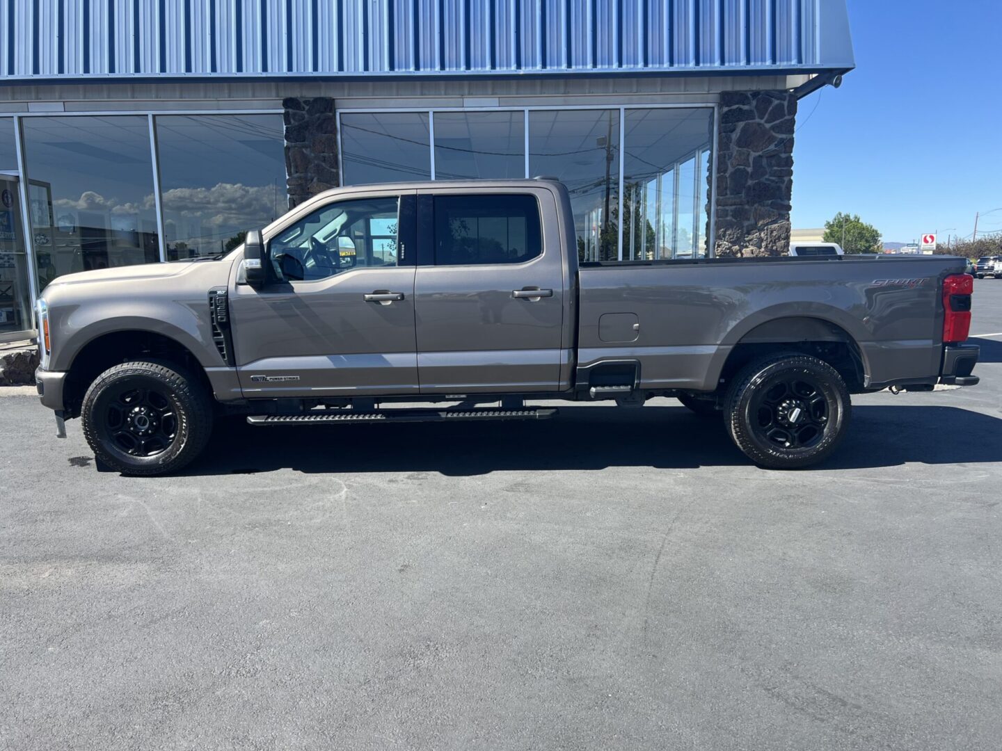 A truck parked in front of a building.