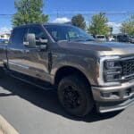 A silver truck parked in the parking lot.