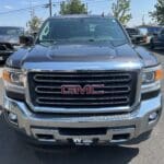 A truck parked in a parking lot with other vehicles.