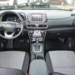 A dashboard and steering wheel of an suv.