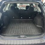 A car trunk with the back seats folded down.