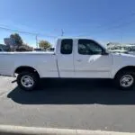 A white truck parked in the parking lot.