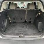 A car with the back seats folded down and the trunk open.