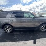 A gray suv parked in the parking lot.