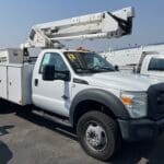 A white utility truck parked in the lot.