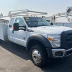 A white truck parked in the parking lot.