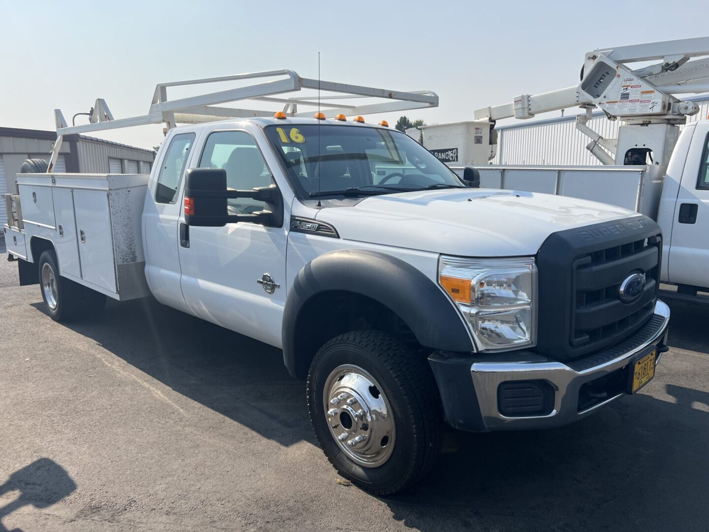 A white truck parked in the parking lot.